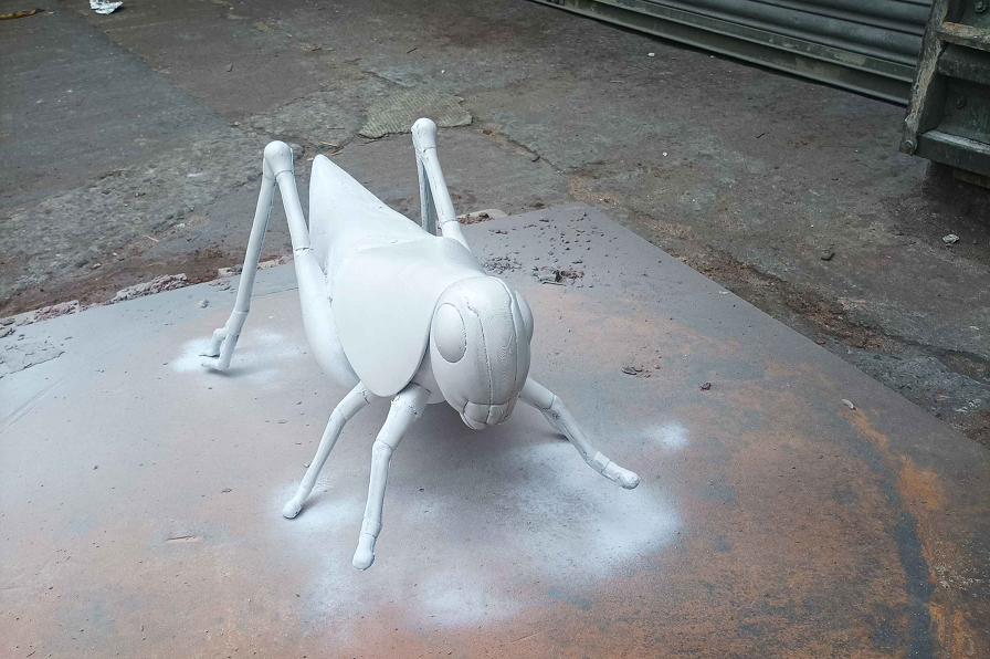 Grasshopper sculpture, alternate view